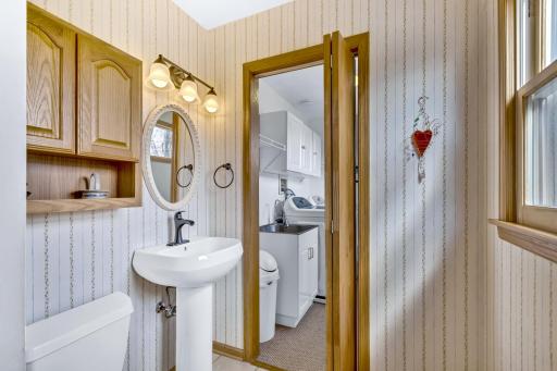Convenient half bath off kitchen along with main floor laundry.