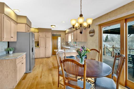 Spacious, updated eat-in kitchen with patio doors leading to deck.