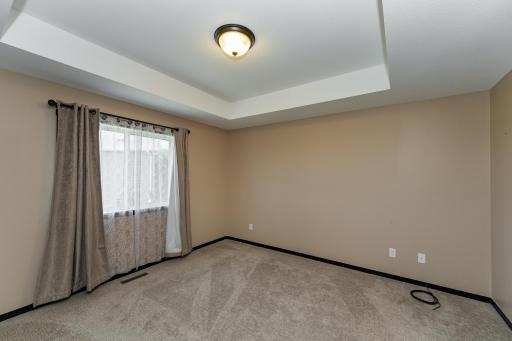 Primary suite with attached bath and walk-in closet