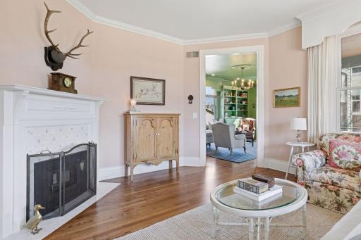 Wood burning fireplace with hand-painted tiles.