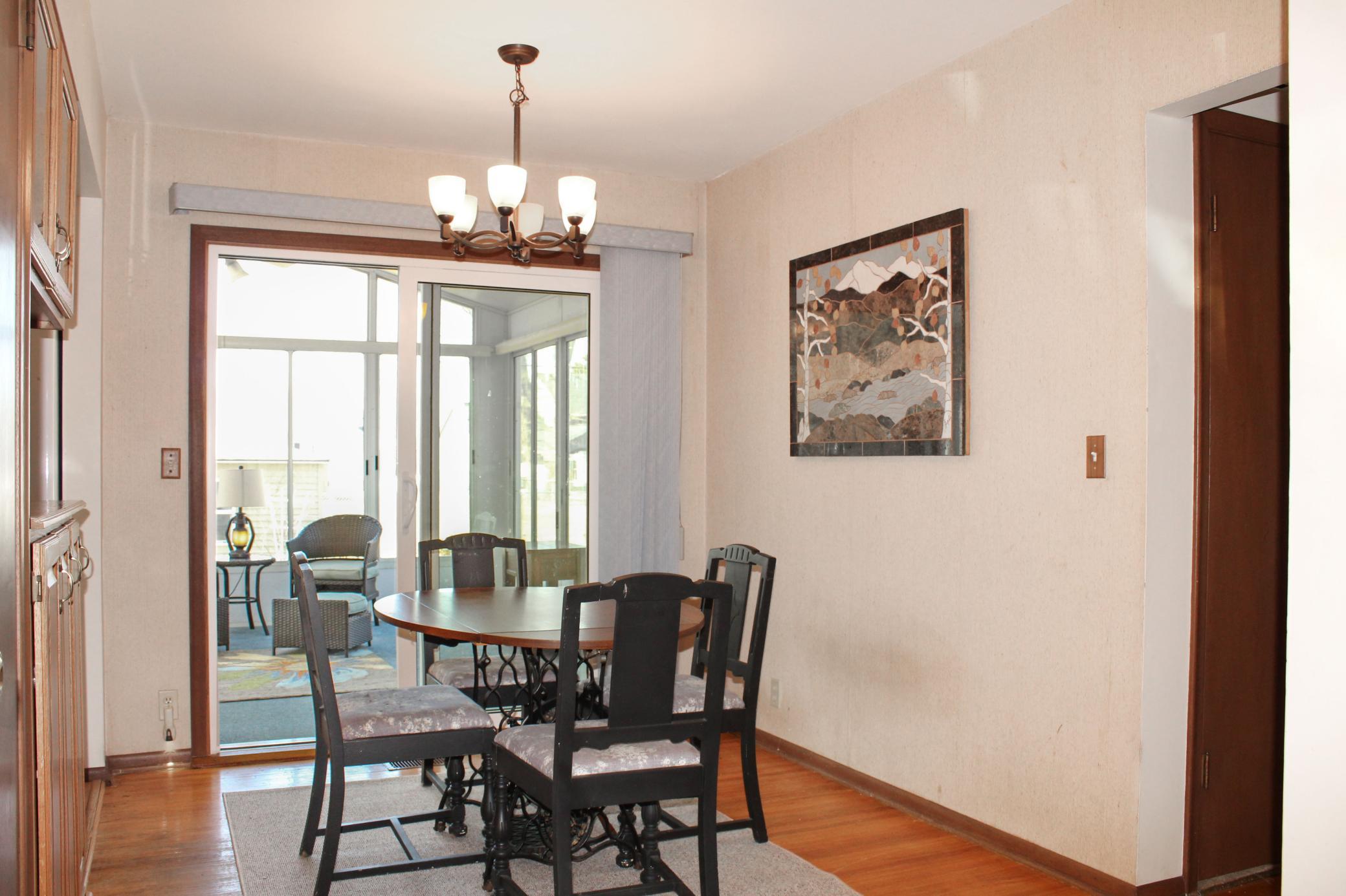 Dining room with walkout to three season porch