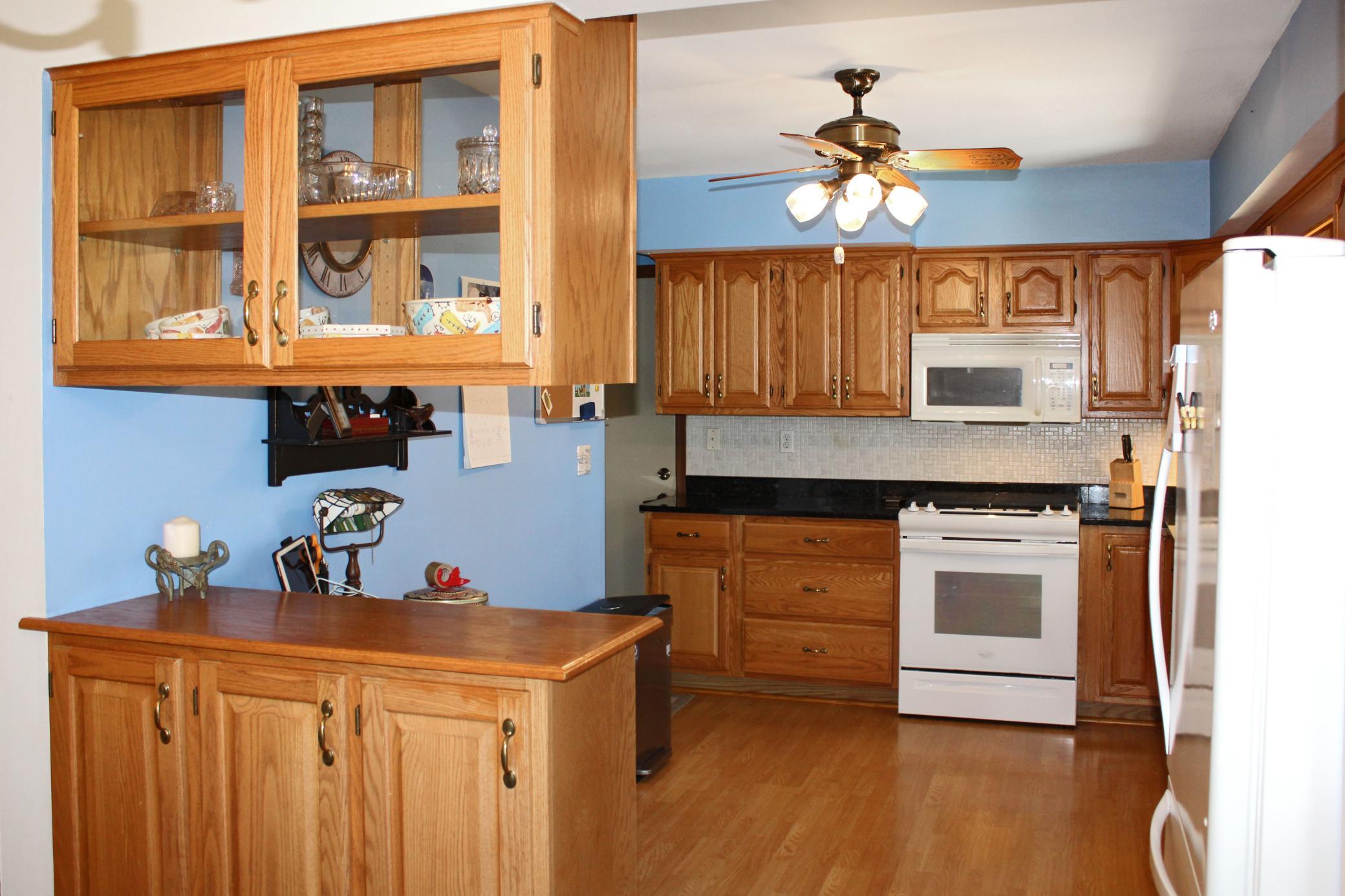 Kitchen with updated cabinets and granite countertops