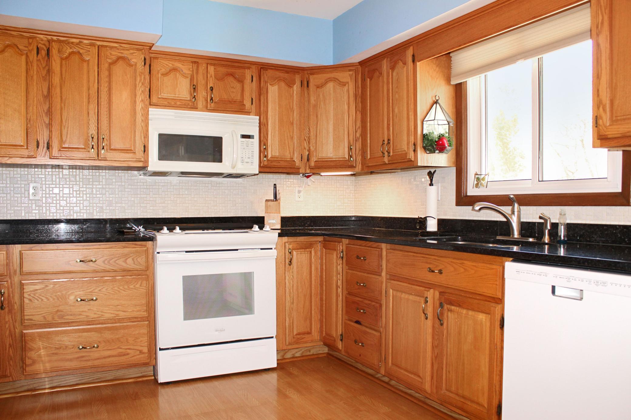 Kitchen with updated cabinets and granite countertops