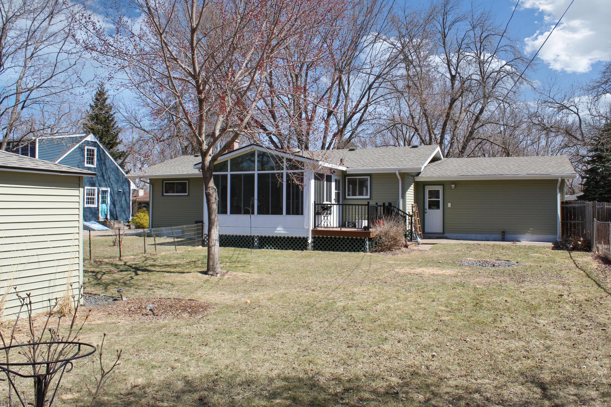 Rear exterior with porch and storage shed