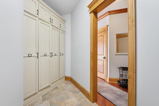 Mudroom with storage cabinets to tuck away ALL THE STUFF!
