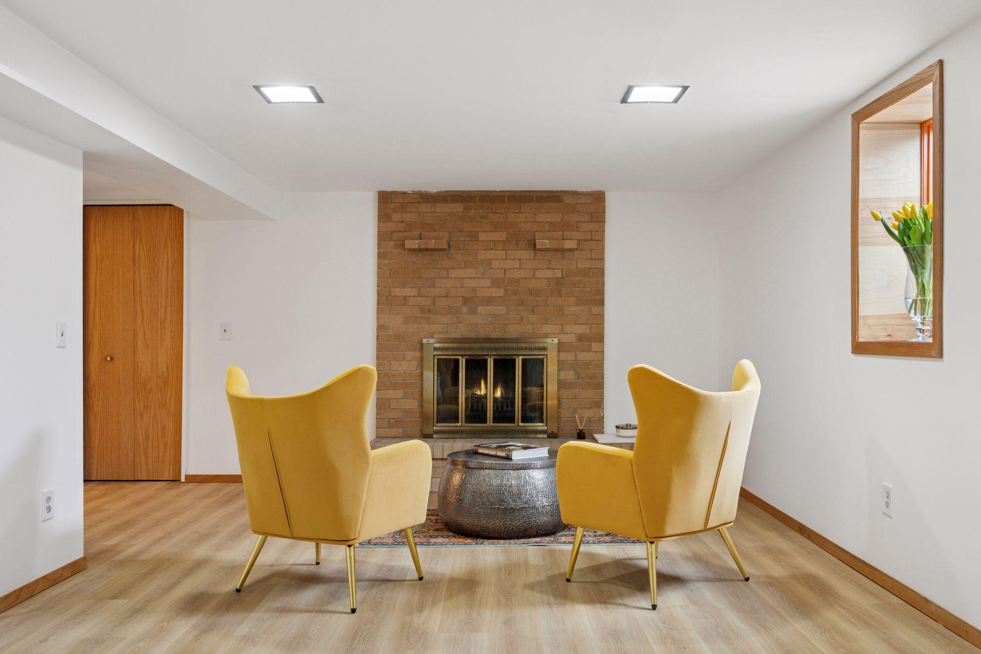 Lower level family room (wood-burning fireplace aesthetic only)