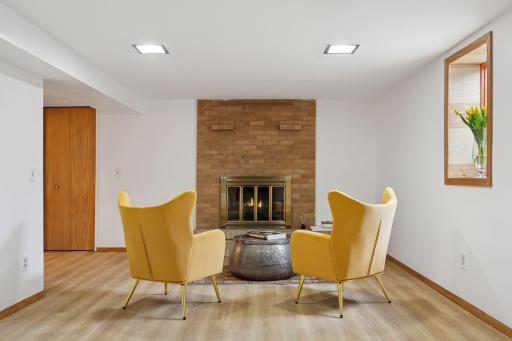 Lower level family room (wood-burning fireplace aesthetic only)