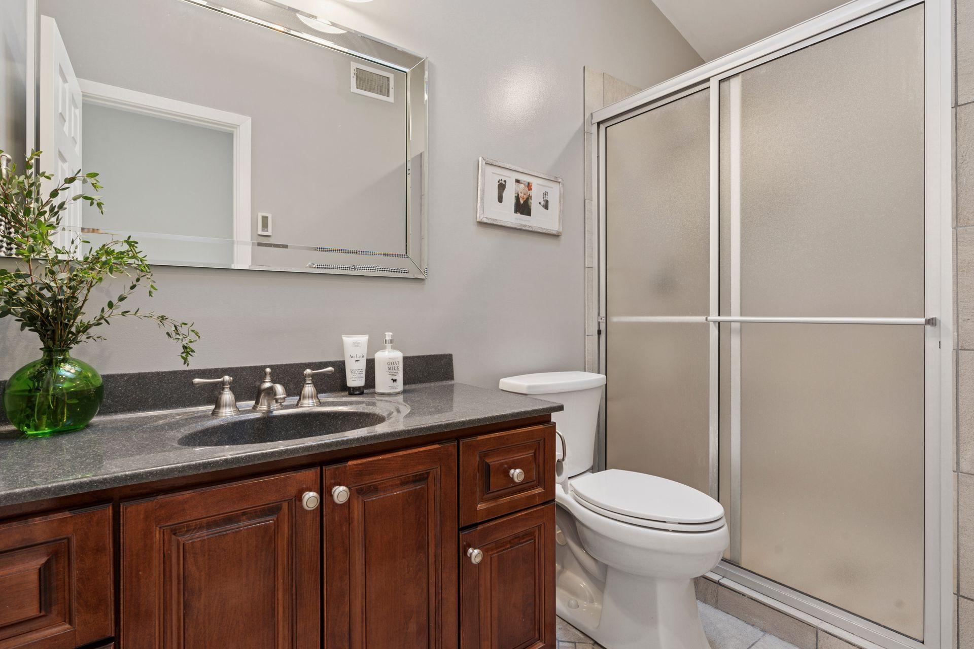 Remodeled 3/4 guest bathroom.
Walk-in ceramic tile shower and lovely quartz topped vanity.