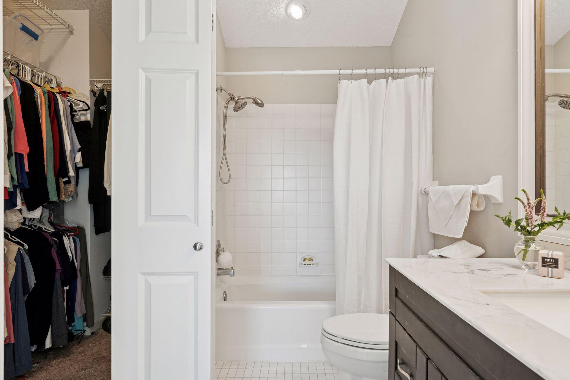 Easy access to especially large walk-in closet big enough to share, and includes well planned closet organization.