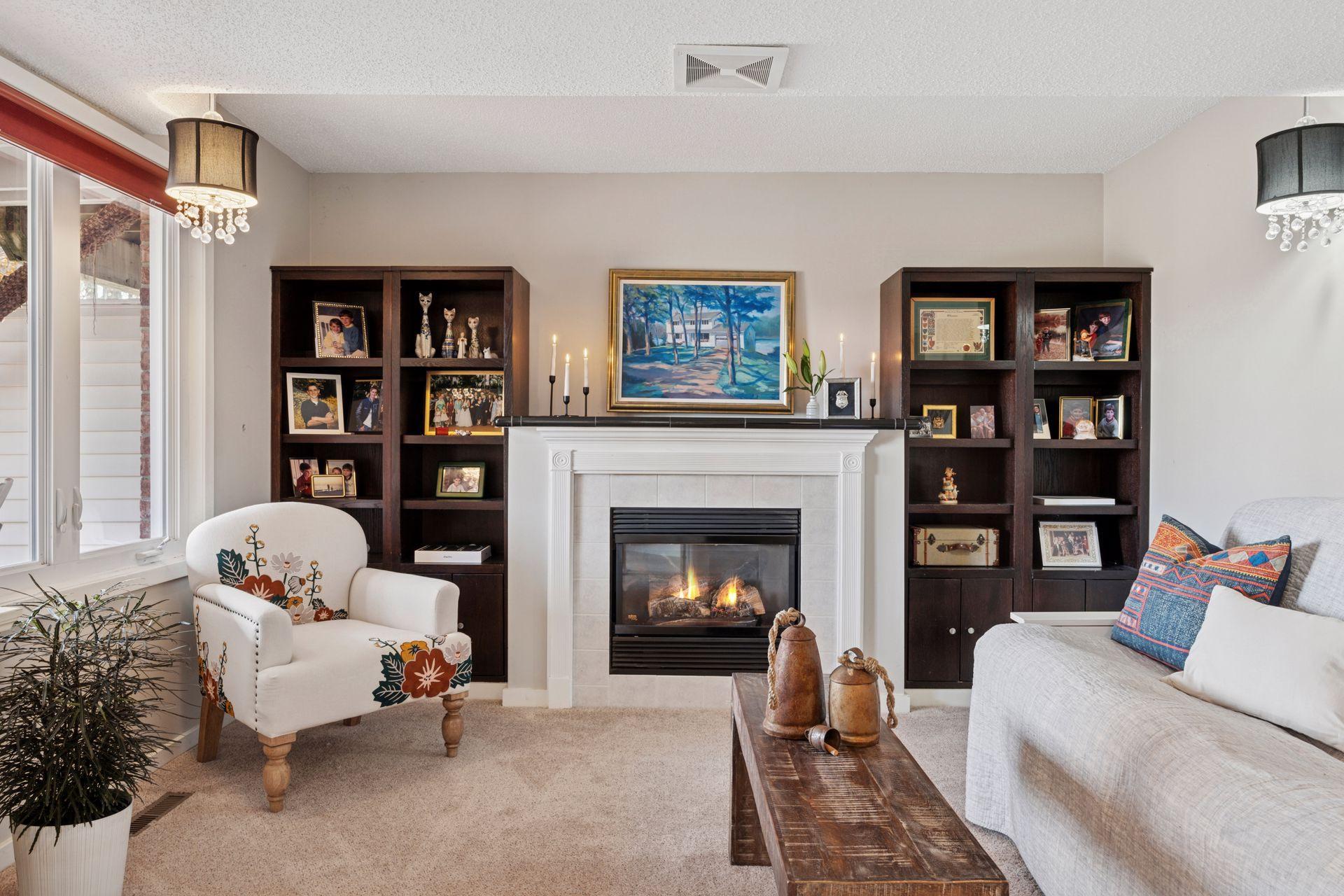 The family room is highlighted by a gas fireplace flanked by custom bookcases.