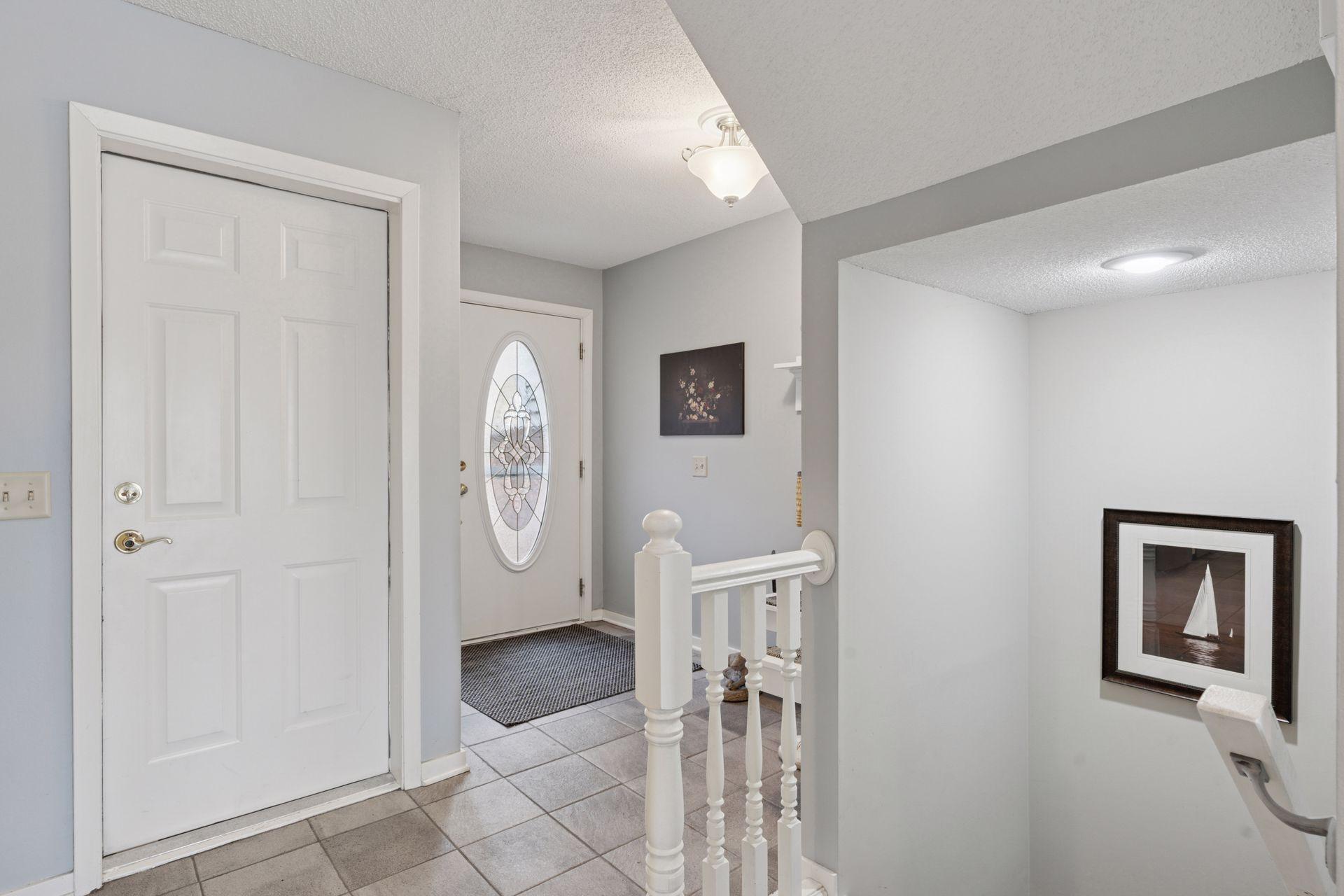 Open, turned staircase providing access from the main floor to the lower level.