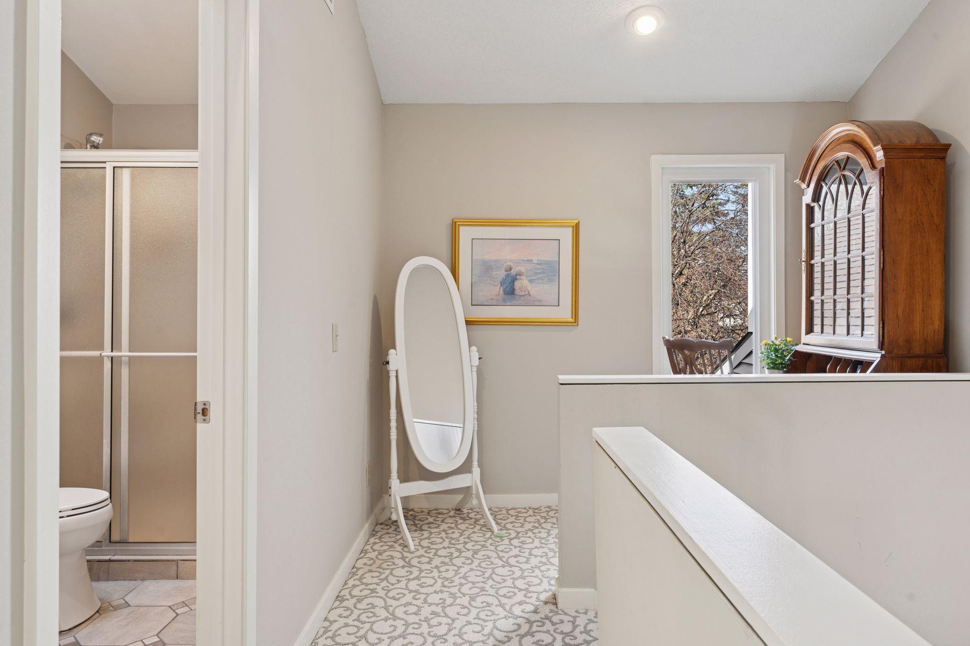 Charming hide-away overlooking the woods to the front of the home.