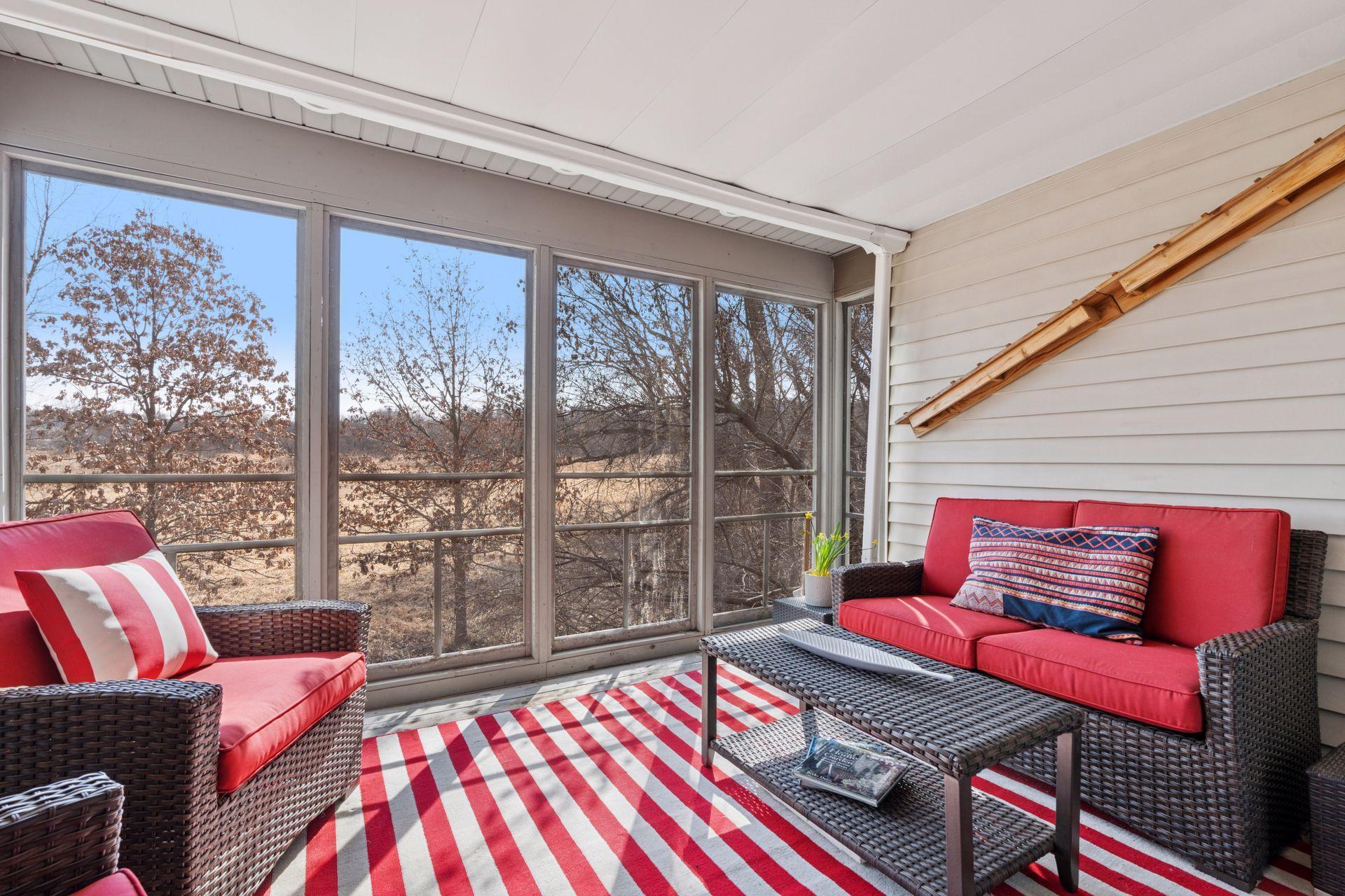 The screened porch is tucked away from the the main open floor plan. A place to experience bird watching, including eagles and song birds, and overlooks a wildlife sanctuary.