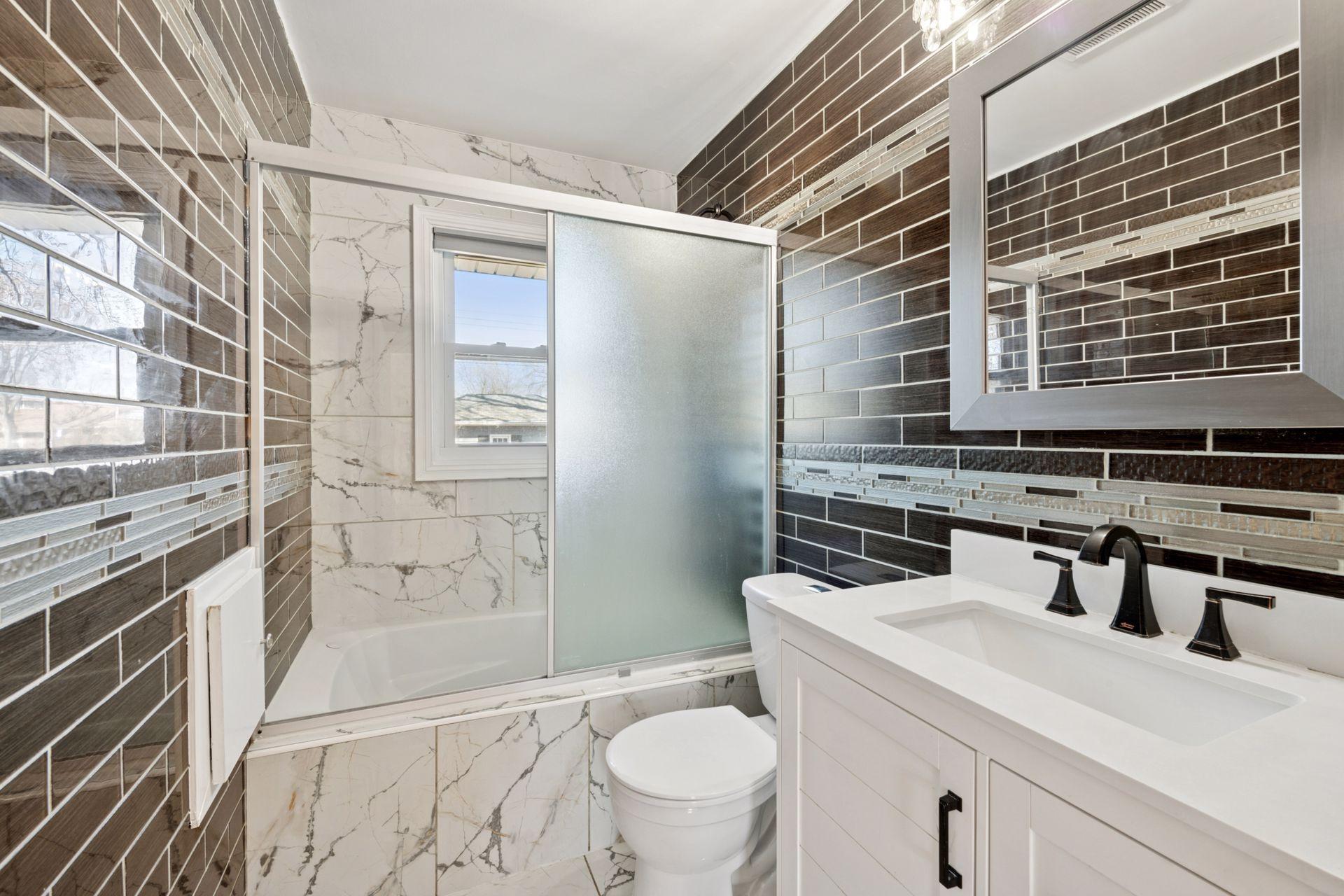 Newly updated and re-tiled main floor bathroom
