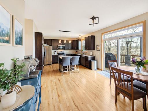 Open concept leads into kitchen with room for a casual dining table, transforming it into a breakfast nook.