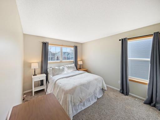 Bedroom with two windows and double closet.