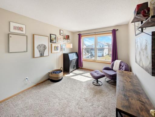 Bedroom or hobby room with closet and large window for natural light.