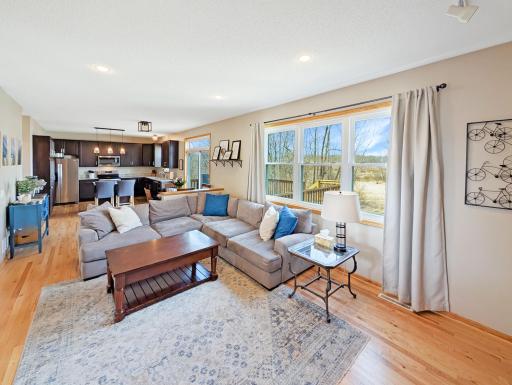 Living room with lots of natural light along with recessed lighting.