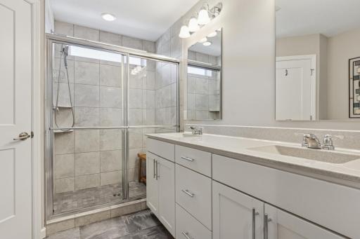 Ensuite primary bath, oversized walk-in shower, dual vanity and private water closet