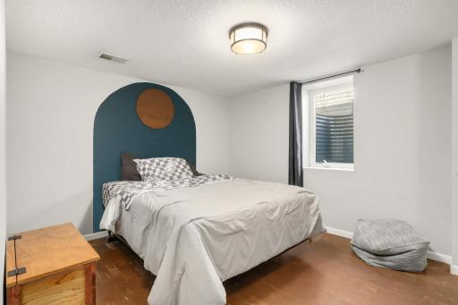 One of two additional bedrooms located downstairs.