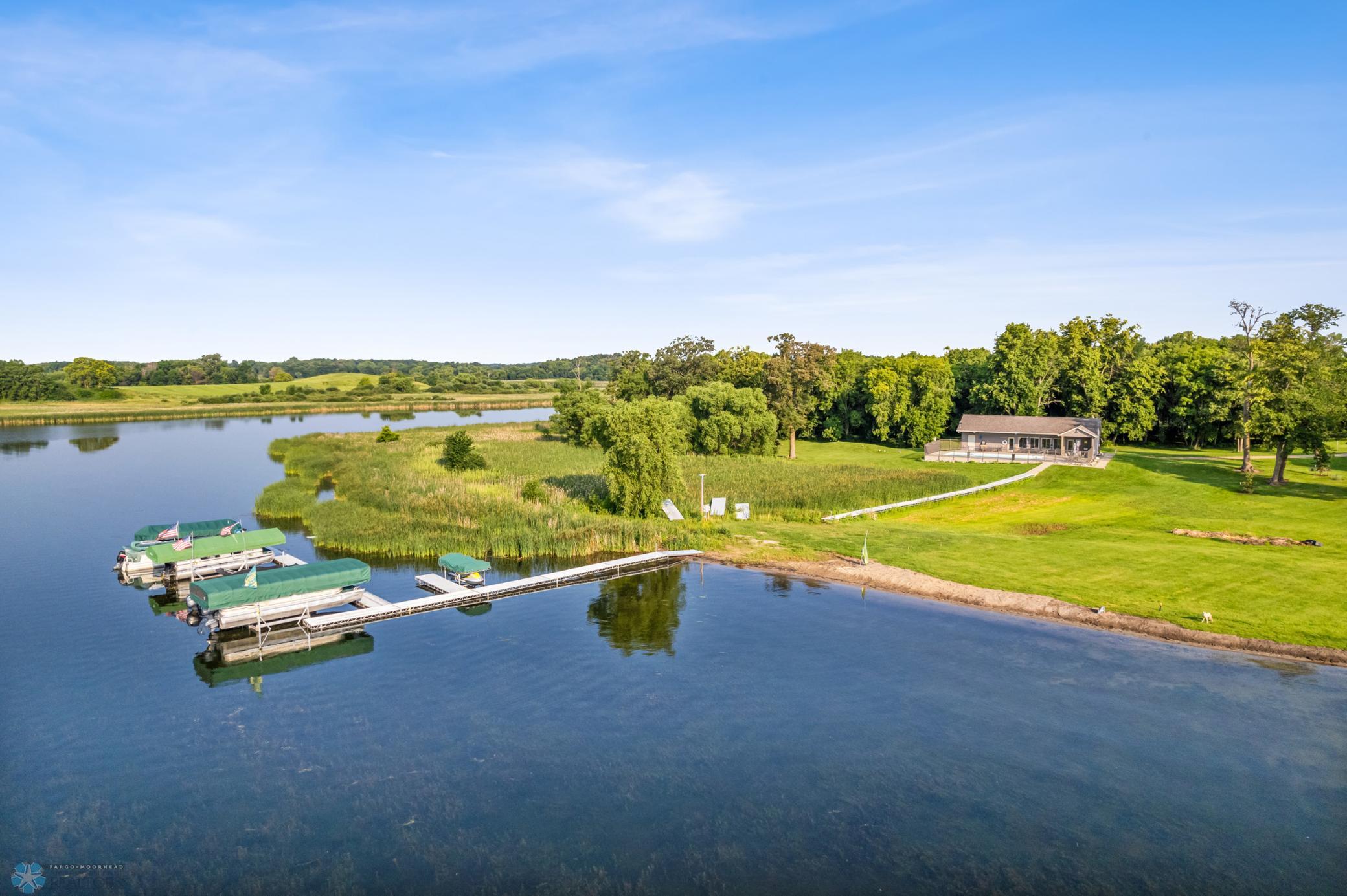 Optional HOA membership includes public swimming beach with hard sandy bottom, clubhouse access, heated pool and boat slip on Lake Lida.