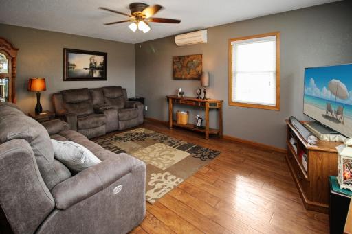 Main floor living room with hardwood floors and a ductless mini split for AC.