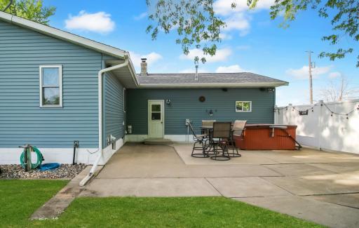 Patio area with a hot tub- great for relaxing or entertaining!.jpg