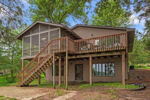 Welcome to year-round lake living on beautiful Cedar Lake! This charming walkout rambler is perfectly positioned on a gently sloping half-acre lot, offering easy access to the water and picturesque views.