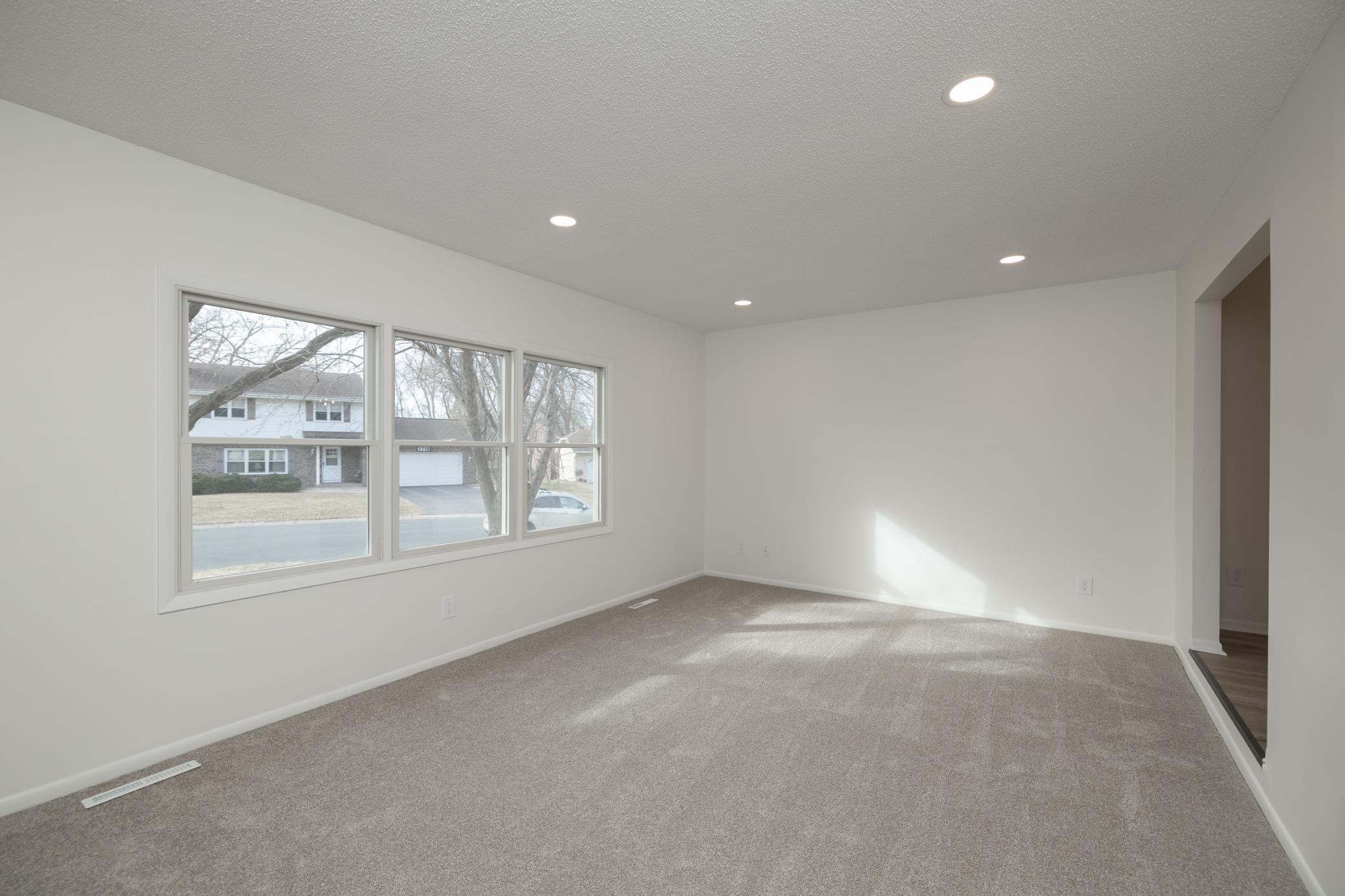 Main floor living room with all new recessed lighting