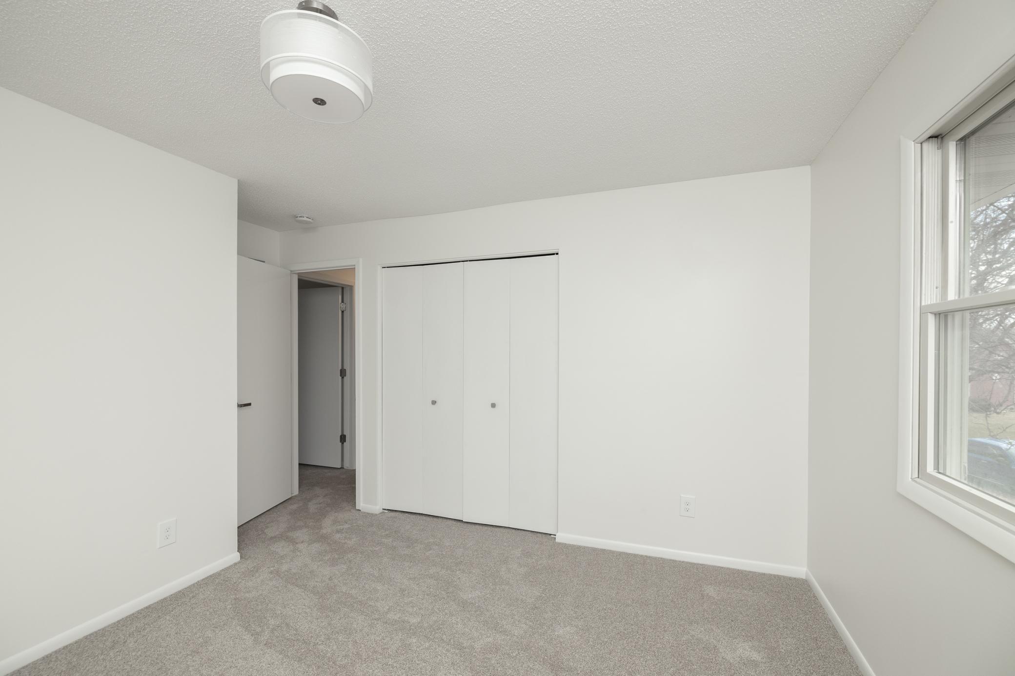 One of three upper level bedrooms