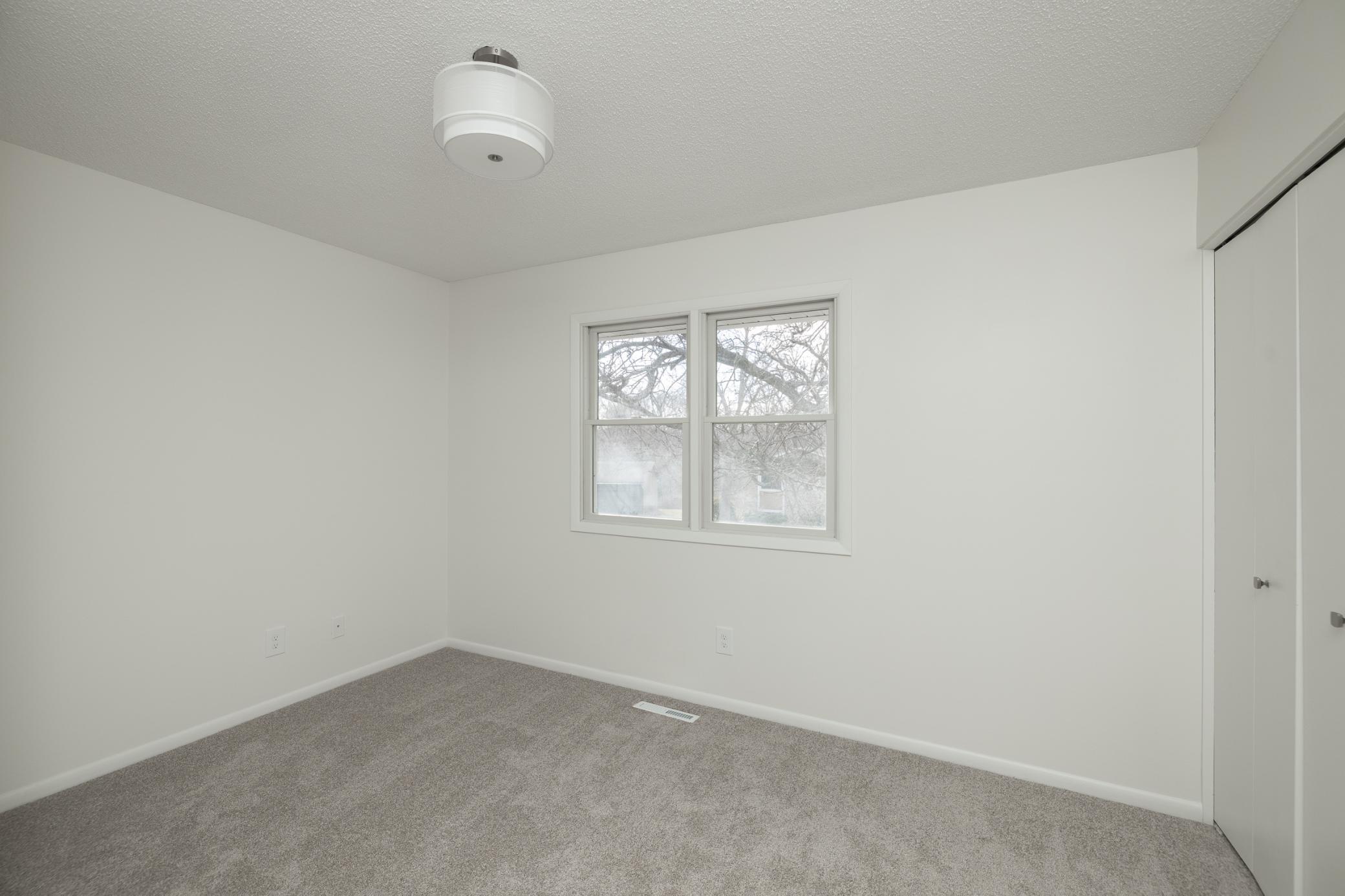One of three upper level bedrooms