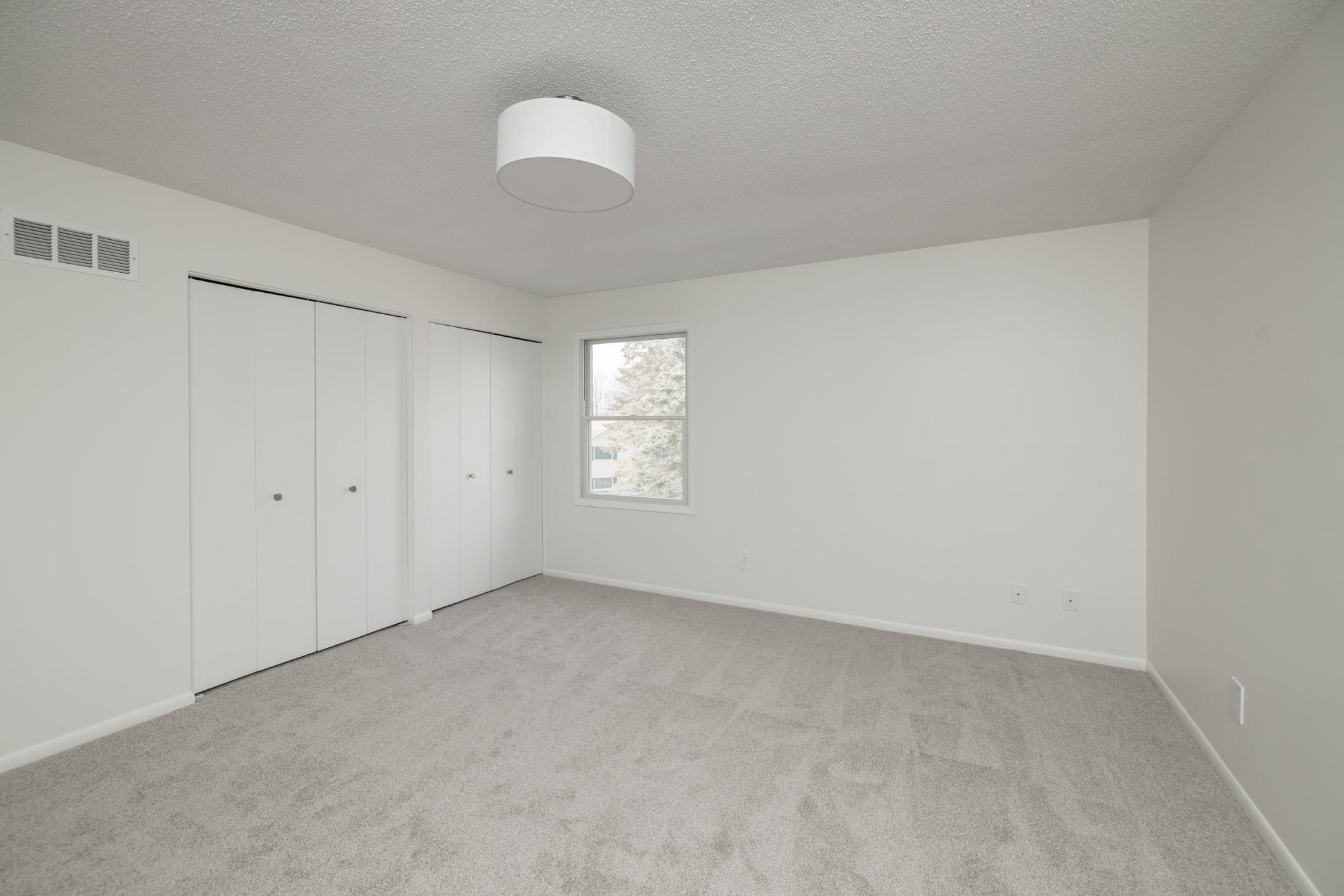 Spacious bedroom with double closets
