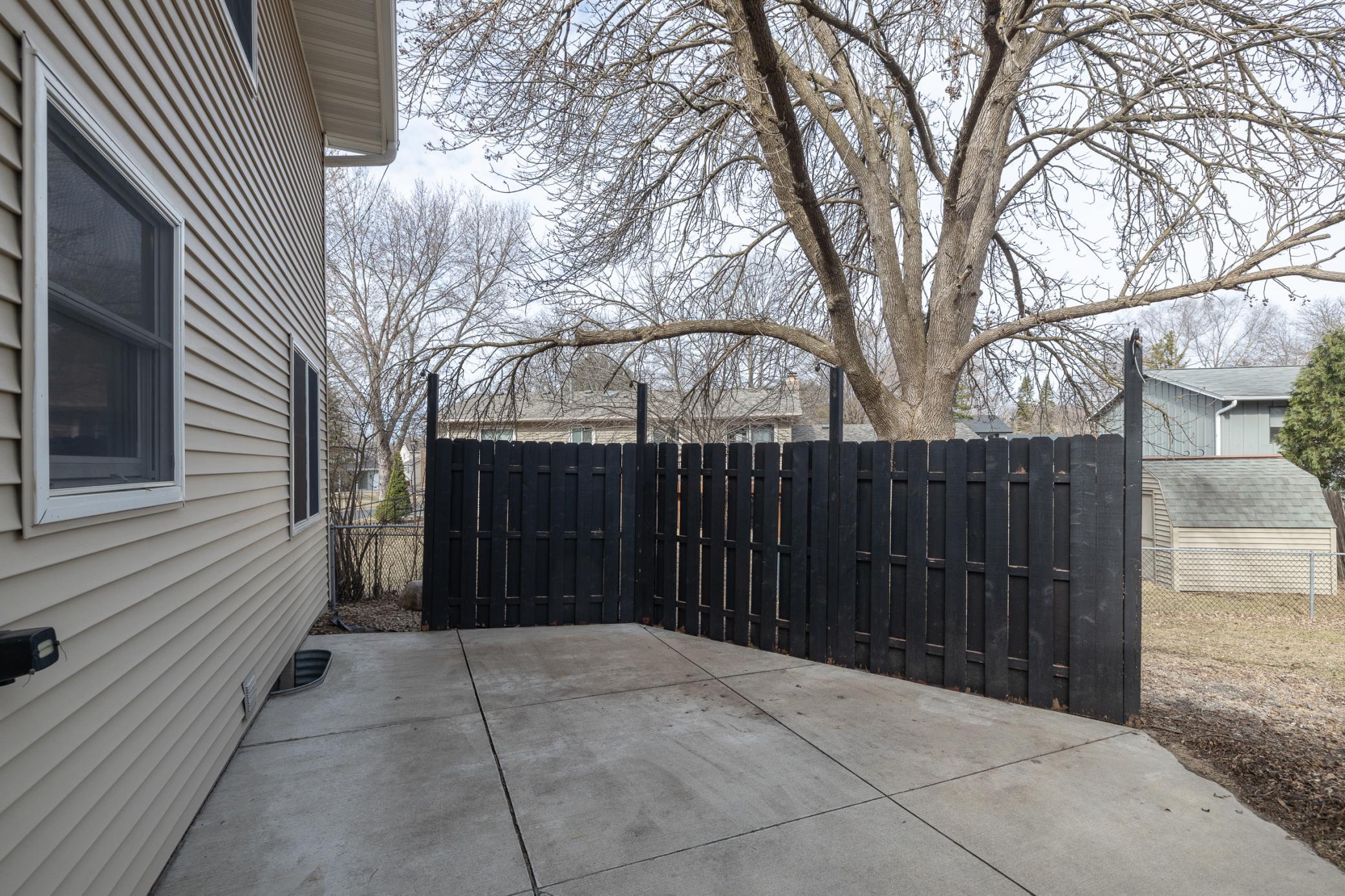 Patio area with partial privacy fence