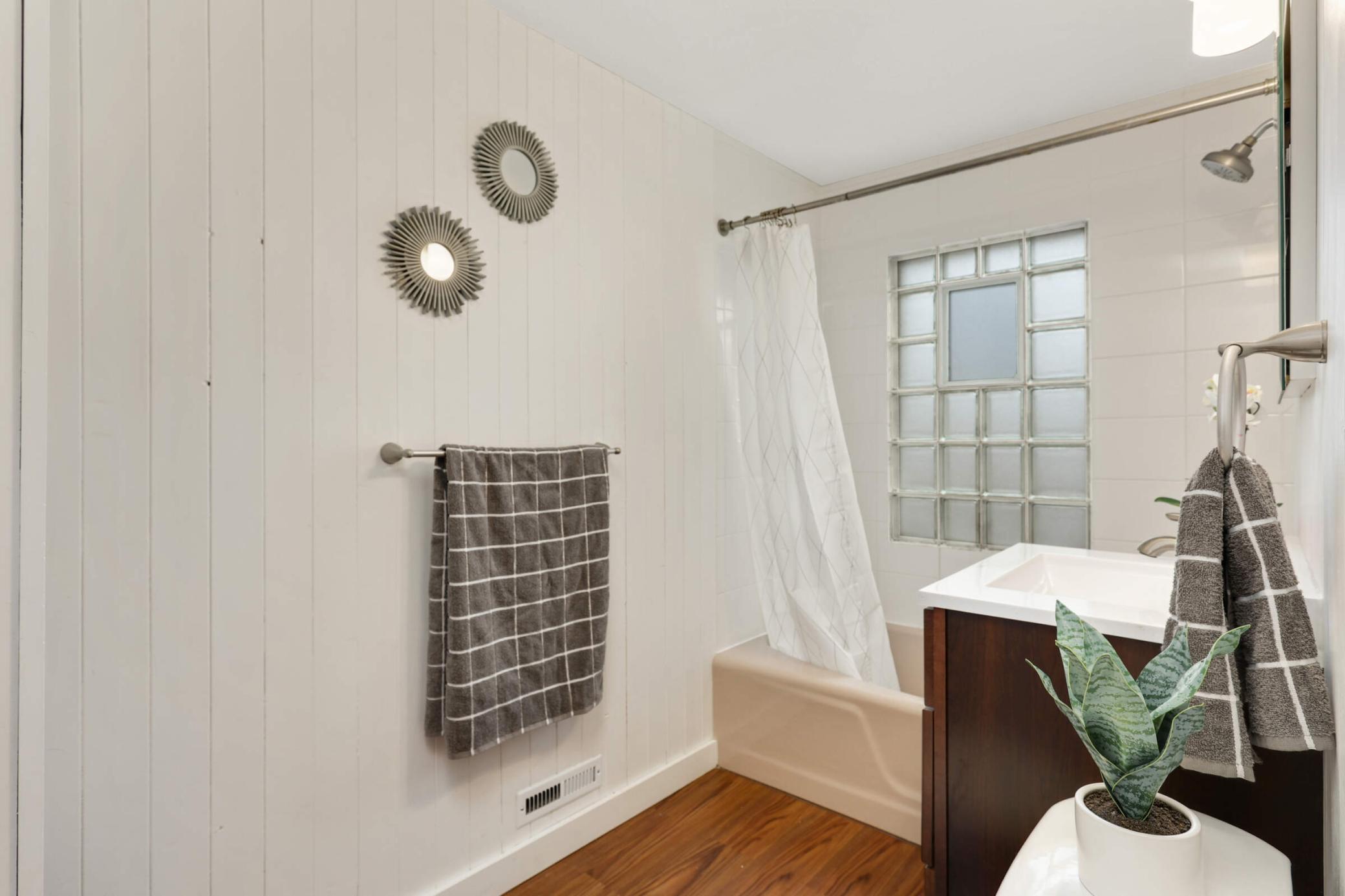 Spacious upstairs full bathroom featuring classic finishes and plenty of room for comfort and convenience.
