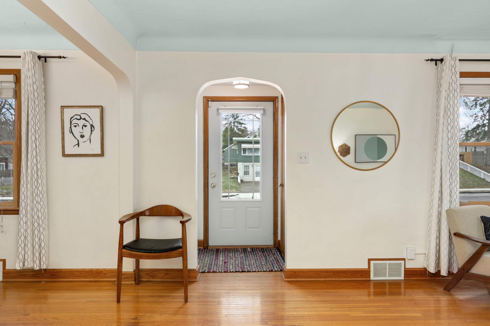 Welcoming front foyer featuring a timeless arched pass-through that adds charm and character right as you enter.