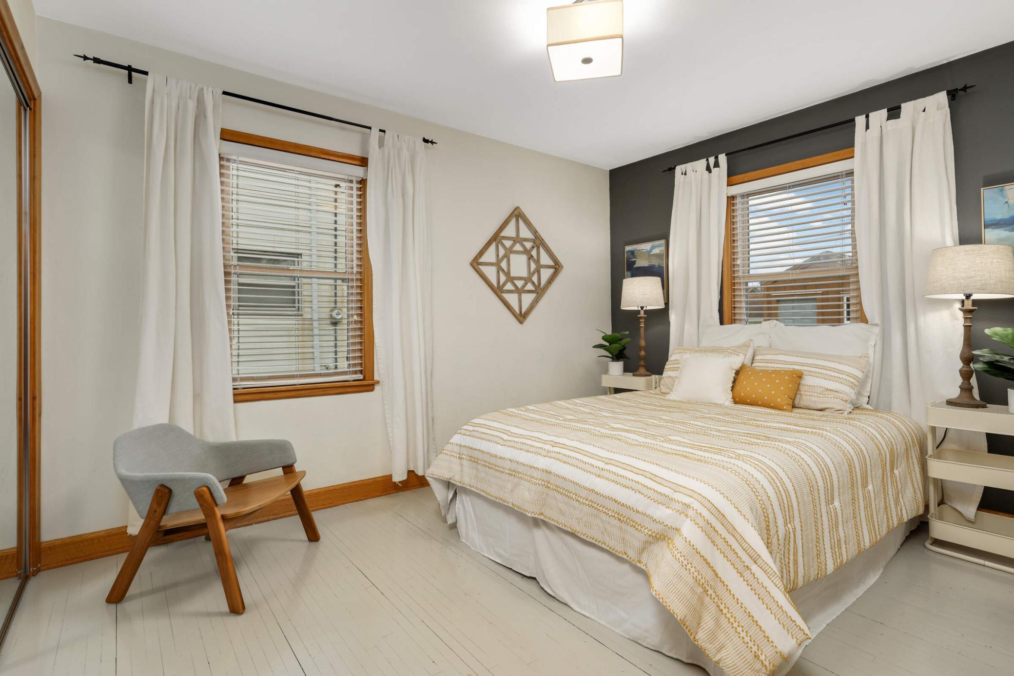 Main floor bedroom featuring generous closet space and easy access to the adjacent full bathroom—comfortable and convenient for everyday living.