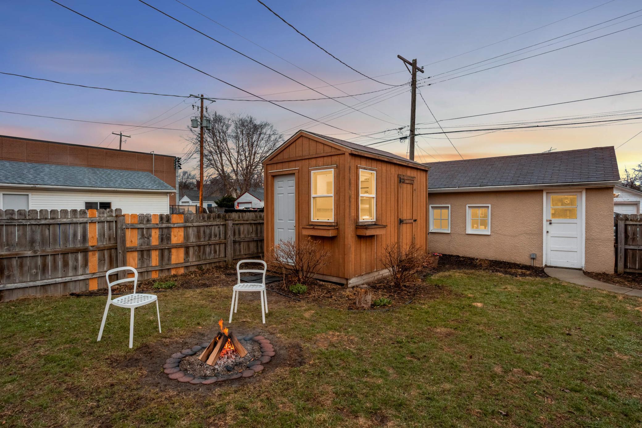 Spacious backyard featuring a storage shed with heated work-at-home office studio perfect for a quiet retreat or additional.