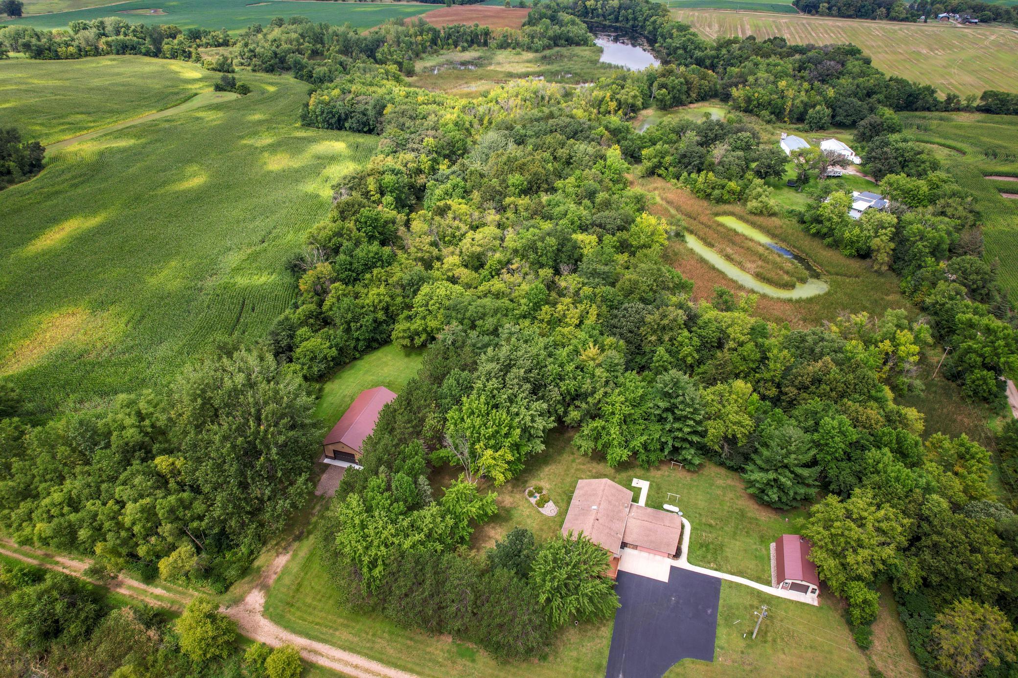 The property features trails through the woods.