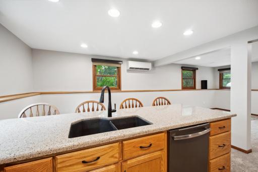 Brushed stainless appliances including a dishwasher & composite sink.