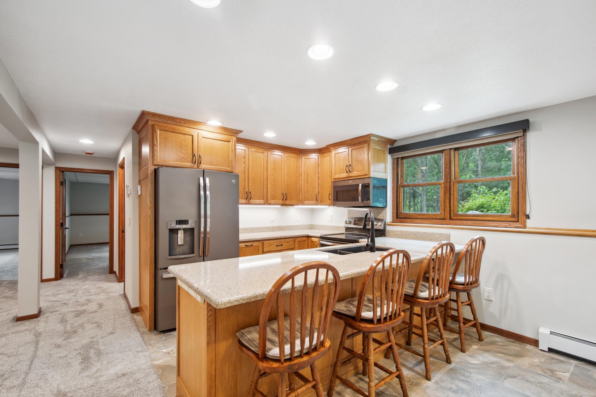 Quartz counter tops and custom Oak cabinets.