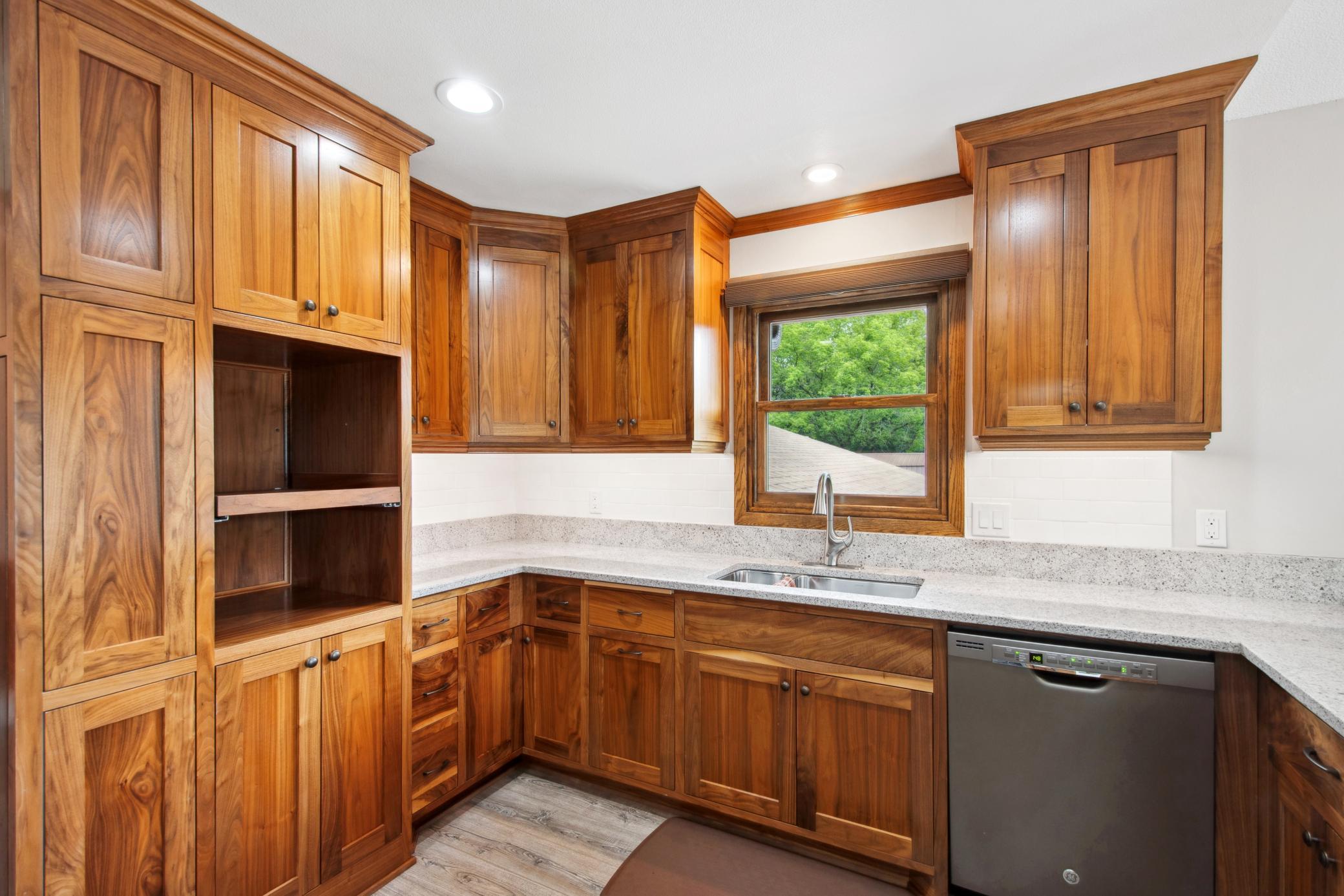 Solid core custom walnut cabinets. Stainless steel sink.