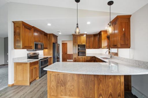 Kitchen remodel in 2017 features walnut custom cabinets.