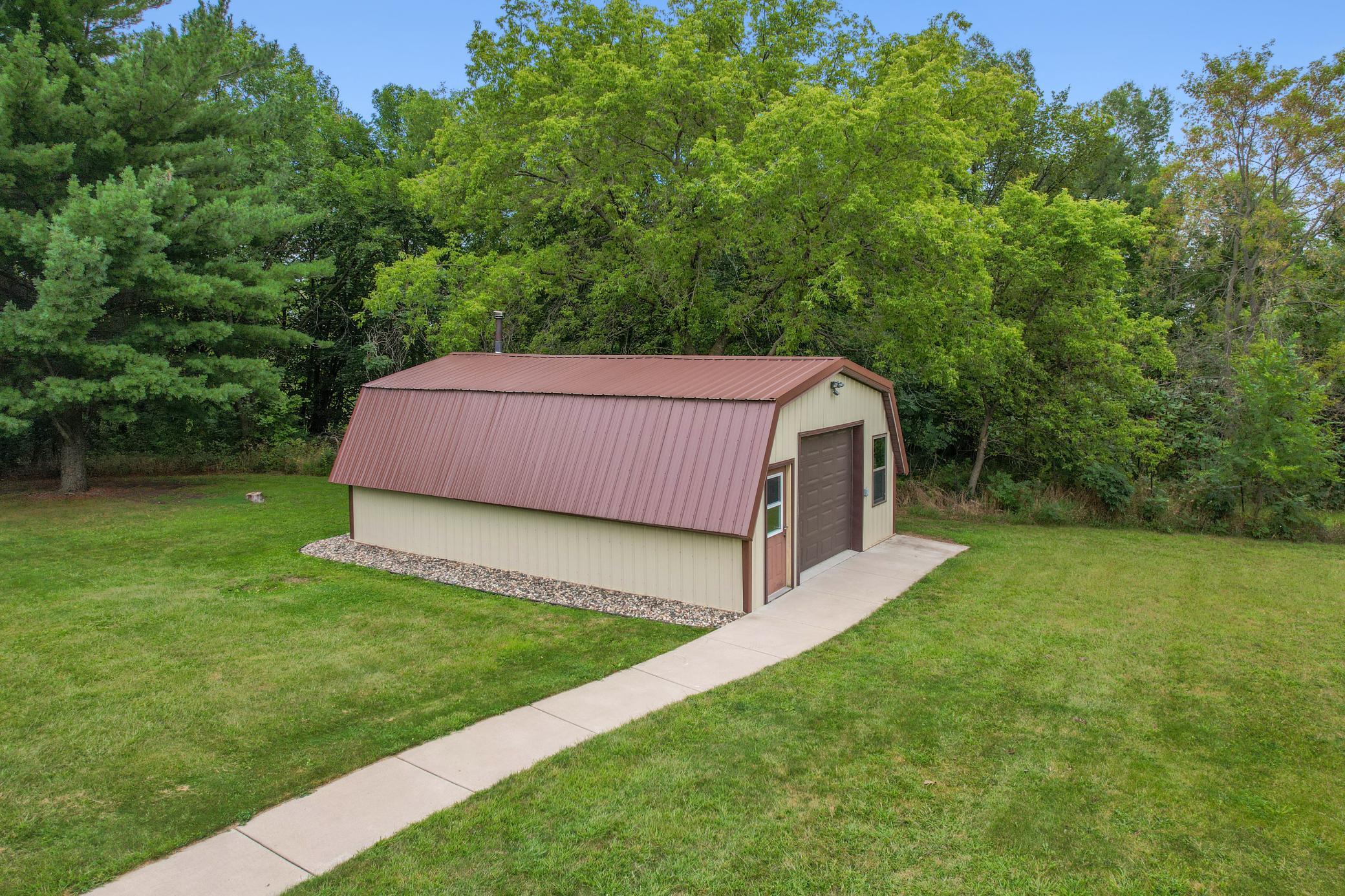 20 x 31' shed has, a concrete floor with epoxy coating & a wood burning stove. Great place for a man cave/she shed, extra parking or storage.