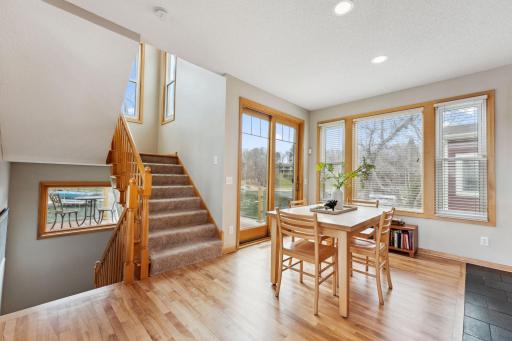Bright informal dining space with access to a maintenance free deck with clear glass railings to maximize the views of the bay