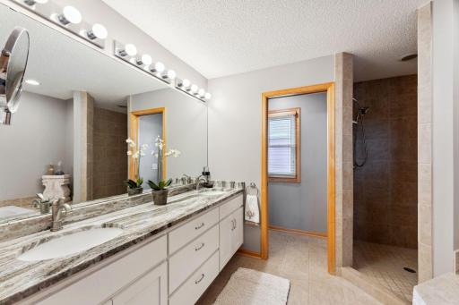 Primary bath with Walk in shower, jetted tub and separate toilet room with pocket door
