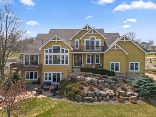 This stunning home sits at the end of a peninsula with 270-degree lake views