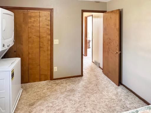 This bedroom doubles as the laundry room right now
