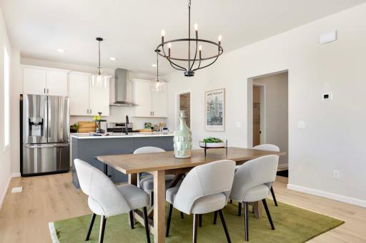 Beautiful, continuous SPC flooring runs through foyer, gathering room, kitchen, dining and mudroom.