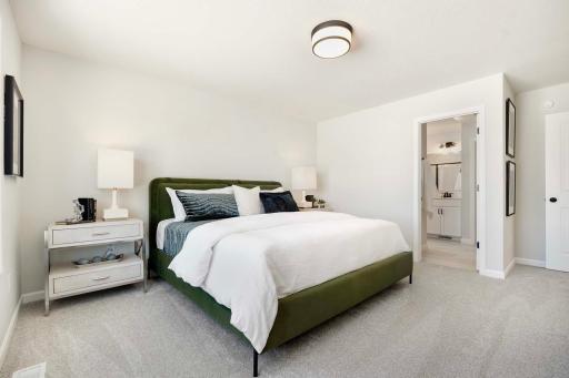 Primary bedroom includes private bath and walk-in closet.