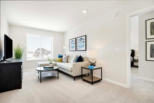 Second floor loft located off entrance to three upper level bedrooms.